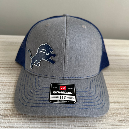 Lions Leatherette Patch Trucker Hat – Grey with Blue and Silver Patch