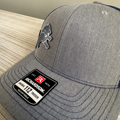 Lions Leatherette Patch Trucker Hat – Grey with Blue and Silver Patch